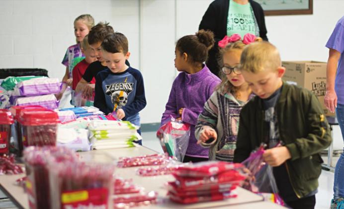 Stroud first graders filled ziplock bags full of items to donate to military families. Photo/Chelsea Weeks