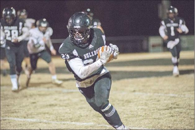 Zach Cook heads for the end zone after a firat-half pass reception against Henryetta. Photo/Brian Blansett