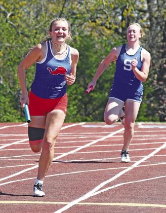 Chandler freshman Lila McGough makes the final turn in the 4x200 relay last week at the 66 Conference meet. Photo/Brian Blansett