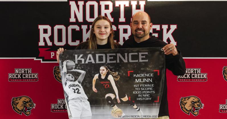 North Rock Creek’s Kadence Munn became the first girl to score 1,000 points for the Lady Cougars. She hit the mark last week against Tecumseh at the Washington tournament. She is shown with coach Lance Blocker. Photo/Sheryl Gowin