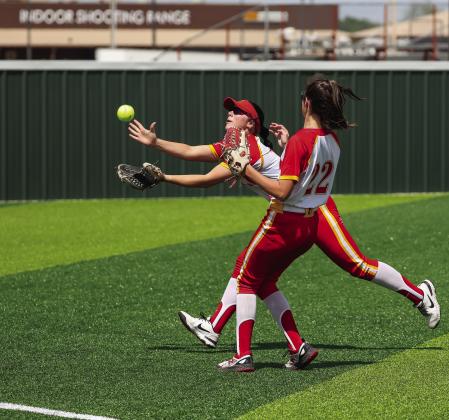 The shortstops from Chandler and Dale flashed their athleticism during district play last week. Above, Chandler shortstop Ruthie Capps barehands a grounder and, right, Dale’s Karsen Griggs makes the running catch while Gracee Waller tries to avoid contact. Photos Brian Blansett and Rick Hester.