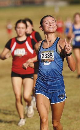 Peyton Davis, one of two seniors on the team, peaces out during the meet Prague. Photo/Beth Young