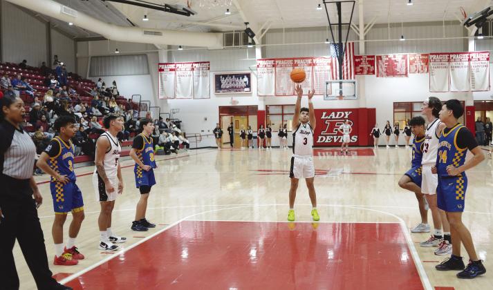 Meeker’s Treyvon Compton puts up a foul shot against Holdenville during first-round action of the 66 Conference Tournament in Prague on Thursday. Holdenville won the tournament, beating McLoud in overtime in the finals. Photo/Brian Blansett