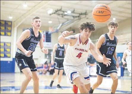 Bottom right, Dylan Mahan makes a play on a ball that appeared headed out of bounds. Photo/Brian Blansett