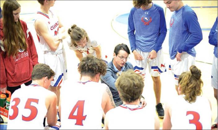 Above, Chandler coach Austin Minshall talks to the Lions during a timeout in their win over Bridge Creek. Photo/Brian Blansett