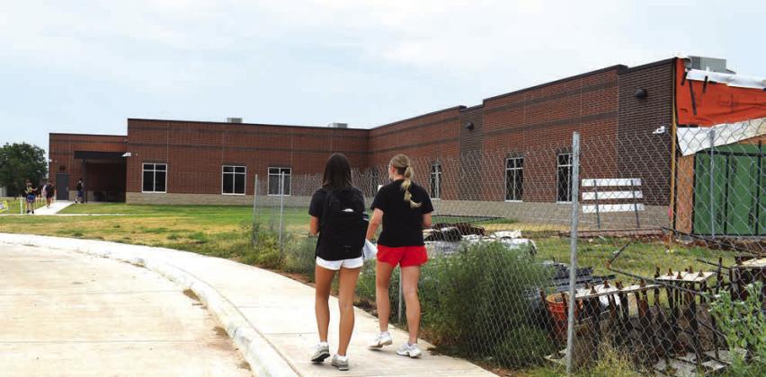 Students walk into the new high school building at Prague. Photo/Emily Kalka