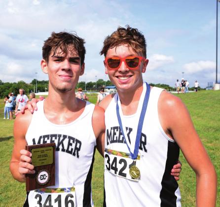 Braxton Bussell, left, and Riley Randall moments after finishing first and second at the Stroud Cross Country meet Saturday. Photo/Brian Blansett