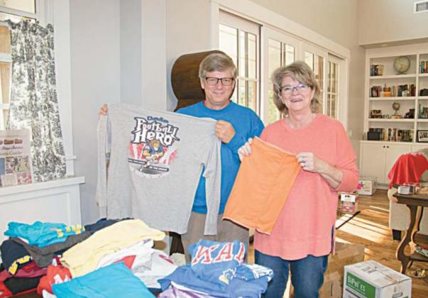 Pictured above, Chandler residents Steve and Jean Lucas hold up t-shirts that will soon be sent to Illinois where they will be cut up and sew into diapers for expecting mothers in Nicaragua through the program Casa Materna, a program through the organization Misión Para Cristo. Photo/Brian Blansett.