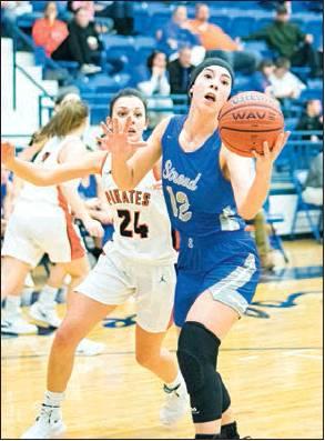In pre-holiday action around the county, Jadyn Young (12) above puts up a one-hander for Stroud. Photo/Tommie Marshall