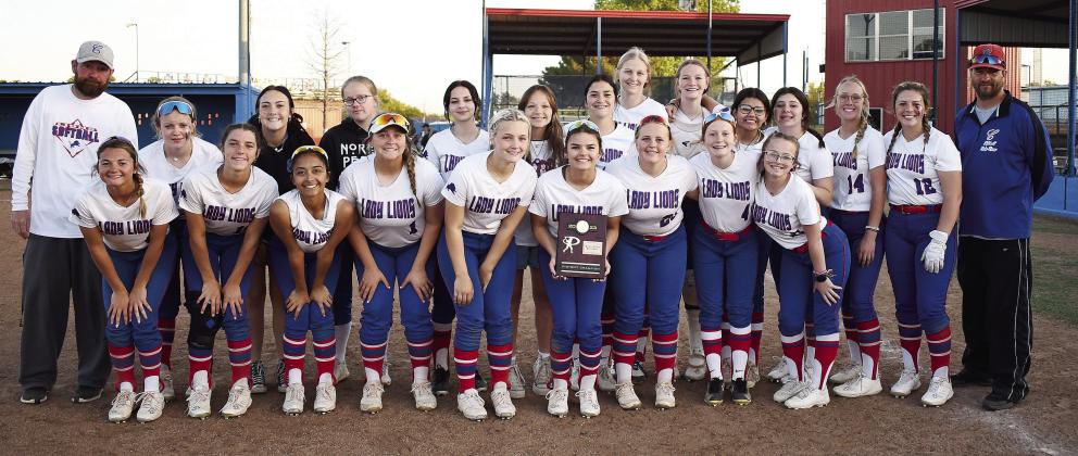 Chandler’s Lady Lions pose with the district championship trophy last week after dispatching Bethel and Ada. Stroud, Dale, Davenport, Prague and North Rock Creek also moved through district play and will be in regionals this week, which are scheduled for Thursday. Prague, Dale and North Rock will play at home while Chandler will go to Tecumseh, Davenport to Canute and Stroud to Warner. For more on the playoffs for softball, track and baseball, please see Section C. Photo/Brian Blansett