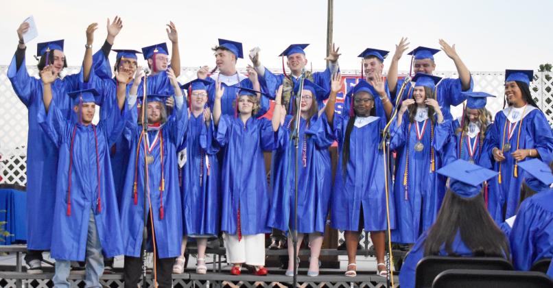 Seniors from the Chandler High School Class of 2025 perform a medley during the graduation ceremony on Friday night at Joe Telford Field. Back row, from left to right: Jake Smithey, Zalen Smith, Ian Radcliffe, Preston Sowder, Nathaniel Nunn, Hunner Robinson and Gage Crews. Front row, from left to right: Caleb Scribner, Joel Telford, Lauren Dollarhite, Madelyn Ledford, Elizabeth Myers, Tiffany Thompson, Cali Hilgenfeld, Tatum Crouch and Halli Murray. Photo/Emily Kalka