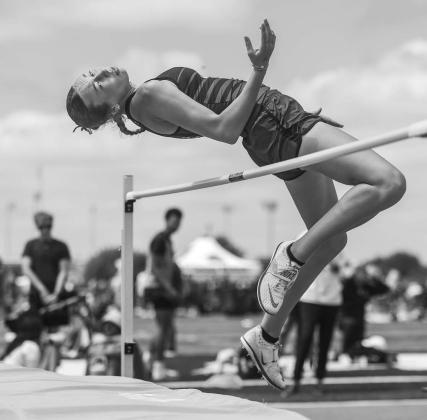 Sophie Young from Stroud eyes her landing spot in the high jump at the Skordle Relays. She won the event with a height of 5-4. Photo/Mario Holland