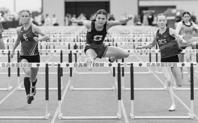 Peyton Davis from Stroud clears a hurdle on her way to winning the 100 Meter hurdles at the Skordle Relays with a time of 15.04. Photo/Beth Young