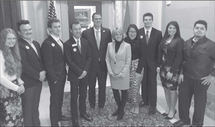 Rose State College students, from left, Aubrey Pruitt and Issac Watham of Meeker and Tanner Hurst of Dale recently visited the State Capitol to participate in Higher Education Day with Rose State College and met with Gov. Kevin Stitt, center. Photo provided