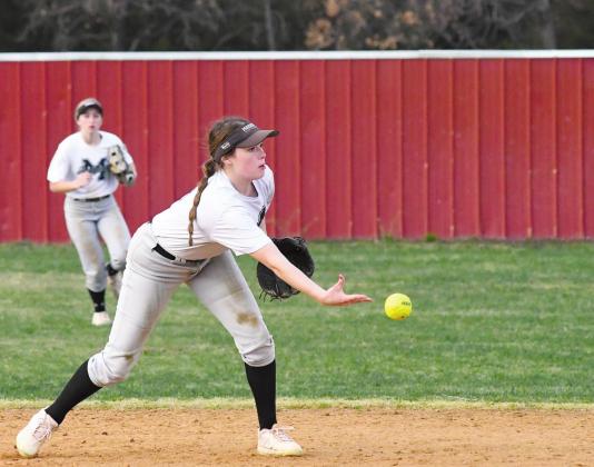 Meeker softball player Kaycee Babek, making a toss to second base for a forceout, was chosen for the Oklahoma Native All-Stte Games. Backing up the play is Callie Seelers, who was chosen for the Games in Cross Country, along with Stroud’s Madison Ham.
