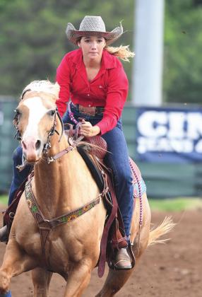 Chandler High School student Kenzie Cowden competes in the International Finals Youth Rodeo in Shawnee. She and her horse, Peaches, were back in the news days later after animals attacked the horse, injuring its legs. Photo/Brian Blansett