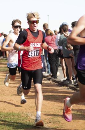 Left, Prague junior Landon Hubert (4311) competes in the Class 3A cross country state meet Saturday at Carl Albert High School. He finished with a time of 16:40.5 and took 11th place. Photo/ Brian Blansett
