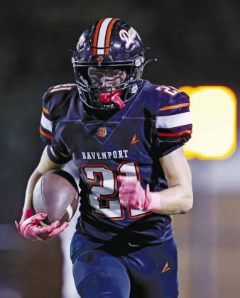 Right, Reece Murfin and the eyeblack on his face prove to be a nightmare for Keota as he runs down the sideline for a Davenport touchdown. Photo/Rick Hester