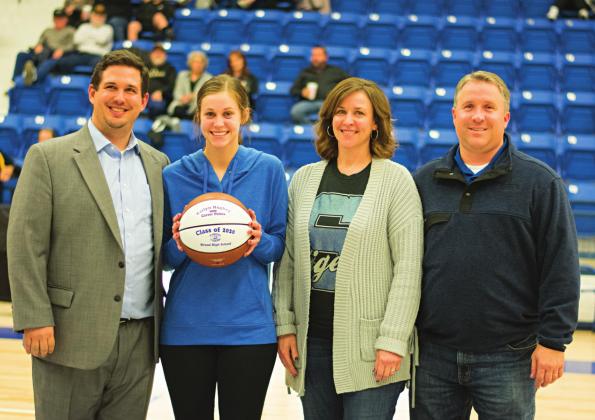 Pictured above, head coach Jake Jobe, Katlyn Hughey and parents Angie and Jason Hughey. Photo/Chelsea Weeks