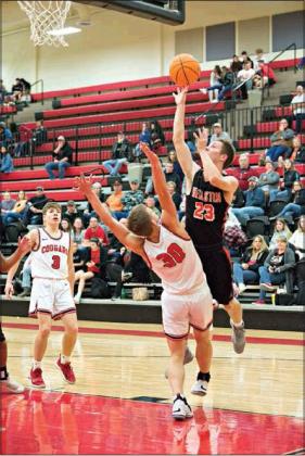 Left, McCoy Caulson (23) puts up a shot in the second half for Wellston’s boys and, below, Rylinn Estes prepares for a free throw. Photos/Brian Blansett