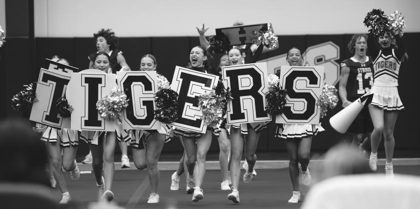 Above, Jackson Campbell, a senior at Stroud High School, wows the crowd on Saturday at the OSSAA 3A Game Day Regionals at Stroud High School. Below, the Stroud Tigers Cheer Team takes the floor for its performance. The team ranked 14th overall with a score of 383.8 at the competition, qualifying for OSSAA Game Day State on Nov. 14 and 15. A total of 32 teams competed in 3A. Photos/Beth Young