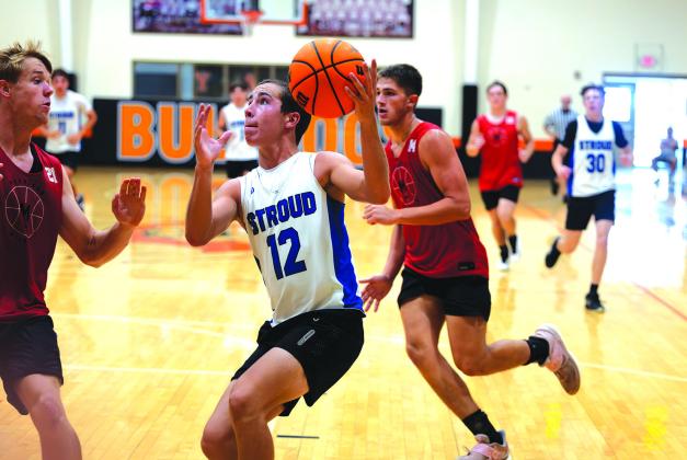 Aiden Young steals the ball and drives in for two points against Morrison. Photo/ Beth Young