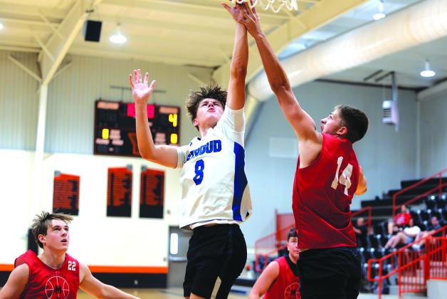 Gideon Smalley goes up for the basket against Morrison. Photo/Beth Young