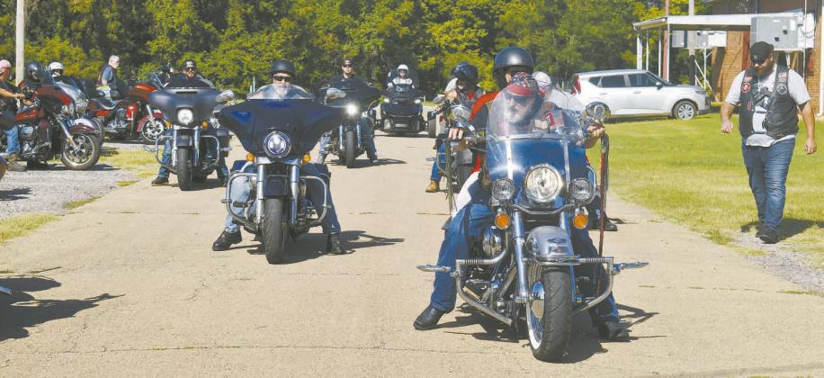A group of about 20 to 30 bikes lines up for a charity right on Aug. 18 at Tilghman Park in Chandler. The ride had bikers from the Roughnecks, Four Kings LE/MC, Honor-Bound Motorcycle Ministry, and other groups and clubs. They raised around $700, which was donated to the Rotary Club for school supplies in Chandler. Photo/Emily Kalka