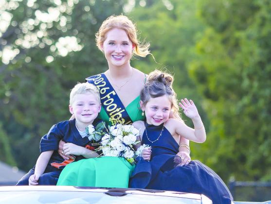 Davenport Homecoming Queen Maggie Walker is pictured with flower girl Stevie Kate Powell and crown bearer Jacob White. Maggie was crowned queen Friday before the Davenport-Depew football game. Photo/Rick Hester