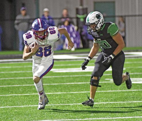 Corbin Hollon (88) heads up the field after a reception Friday night against Jones. Photo/Brian Blansett