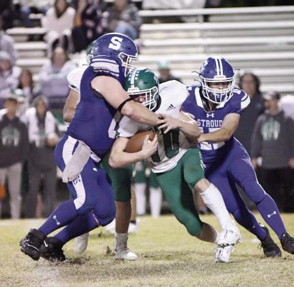 Stroud’s Peyton Gaylord ( 68) and TaylorRozell wrap up Gore’s Devon Mannon during the first half Friday. Photo/Brian Blansett