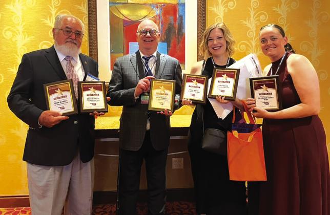 The staff of the Lincoln County News stand with their first-place awards at the OPA conference on June 6 in Norman. From left to right, Sports Editor Brian Blansett, Owner Brett Wesner, Editor/Reporter Emily Kalka and Photographer Jennifer Pryor.
