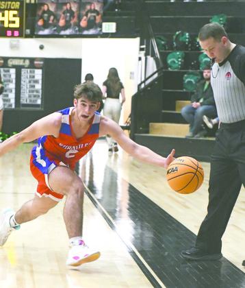 Top, Meeker’s Tatum Pino (2) looks for an outlet pass during the Lady Bulldogs’ game with Prague on Thursday at the 66 Conference tournament. Photo/Brian Blansett. Above left, Chandler’s Gaven Miller (2) tries to keep a loose ball inbounds in the Lions’ championship game against Seminole on Saturday. Photo/Brian Blansett. Above right, Wellston’s Kage Danker (21) heads to the baseline in the WTs win over Tonkawa in the finals of the North Country tournament. Photo/Jeremy Self.