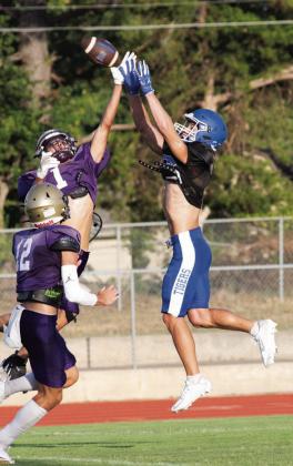 Above, Stroud senior Aiden Collins contends for a pass in the Tigers’ scrimmage against Mannford on Friday. Right, Chandler tacklers make life difficult for Drumright on Thursday. Photos/ Brian Blansett