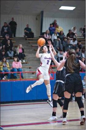 Lower left, Hannah Vandenbrand puts up a shot in the second half. Photos/Brian Blansett