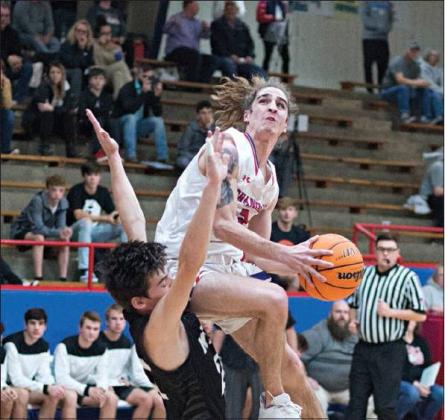 Below, Caedon Parris gets some air against Meeker’s Cade Patterson in the first half of the boys game. Meeker flipped the script in that one, using a 25-point second quarter to take 40-24 halftime lead. Chandler put on a furious comeback in the fourth quarter, getting within a point before Meeker closed out the 66-63 win.