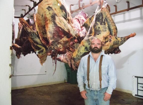 Pictured above, Dustin South stands in front of beef carcasses. Photo/Kendra Johnson.