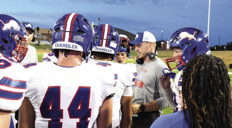 Chandler coach Jack Gray talks to his team during a timeout in the second half. Photo/Brian Blansett
