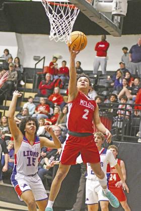 Above, Stroud senior Kileigh Mixon shoots a free throw during the Lady Tigers’ semifinal game against Holdenville. Photo/Mario Holland. Top right, Anna Standlee (5) drives the lane for a shot in Meeker’s game against Prague. Photo/Brian Blansett. Right, Dorrian Matlock (2) lays one in for McLoud. Defending for Chandler is Zalen Robinson (15). Photo/Brian Blansett