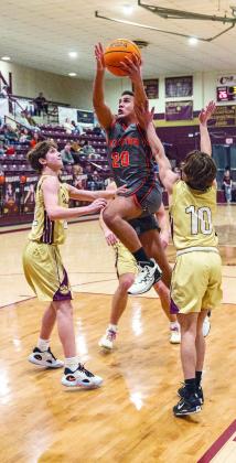 Wellston senior Chance Sanders (20) drives the lane during the Tigers’ game with Cashion last week. The WTs took an 11-5 record into this week’s Tonkawa tournament. Photo/Jeremy Self