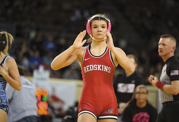 McLoud wrestler Kendra Perrien leaves the mat. McLoud has 14 girls wrestling at the high school level and 16 at the junior high level. Coach William Winters said their program has exploded over the last three years. Photo/ Rhonda Hockenbury