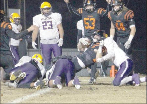 Kyle Hobill (10) scores one of his three touchdowns against Weleetka.