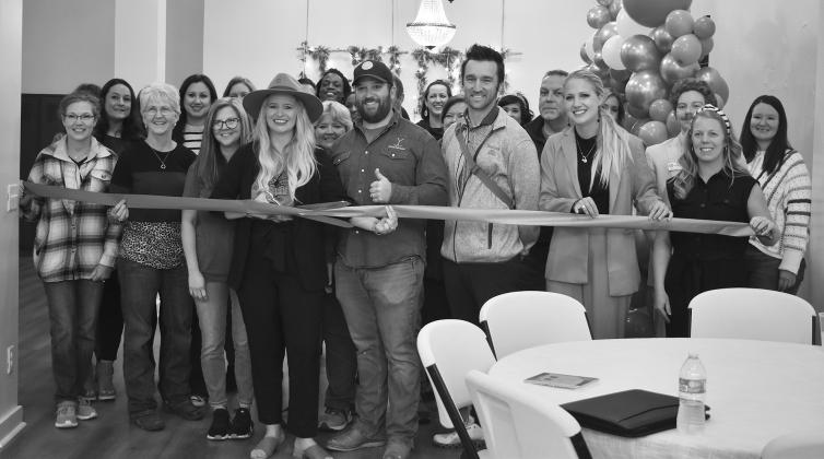 Members of the Chandler Area Chamber of Commerce, along with the owners of Bricks and Branches Event Venue, attend a ribbon-cutting for the new business at 720 Manvel Ave. in Chandler,. They also have a realty office that serves clients in the Chandler, Shawnee, Stillwater and Tulsa area. Photo/Emily Kalka