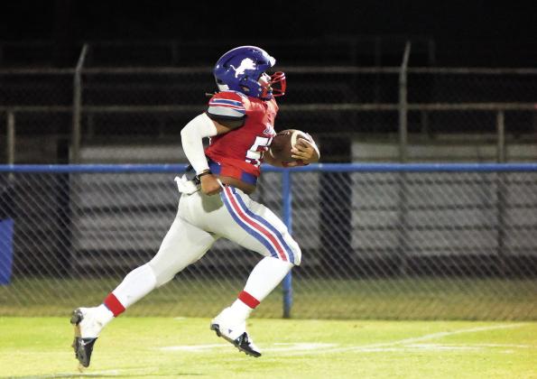 Chandler’s Travian Tillis heads to the end zone after stripping the ball from a Tulsa Webster player Thursday night. The strip-and-score and resulting kick made the score 62-0. It was Tillis’s first game back after an injury. Photo/Brian Blansett