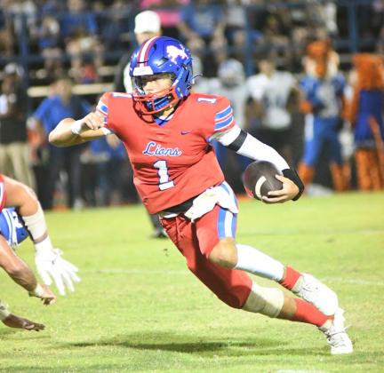 Above, Chandler quarterback Cruz Jackson cuts up the field during the first half Friday night. Photo/Brian Blansett. Below, Trystan Baker (11) grabs a pass for a long reception for Stroud. Photo/Rick Hester.