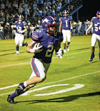 Above, Grant McGinnis (2) heads to the end zone for the winning touchdown in the fourth quarter Friday night. Below left, quarterback Cruz Jackson (1) rolls out in the second half. Photos/Brian Blansett