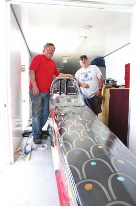 Ralph Snider, left, and Marcus Parks in the trailer with Snider’s jet dragster. Photo/Kendra Johnson