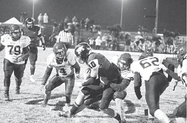 Holdenville’s special teams struggles to tackle Meeker senior Jarrett Marks following a lengthy punt return Friday night. Photo/Brian Blansett