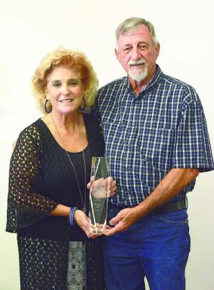 Tracey Bender-Bone (left) and husband Leroy Bone of The Singing Bones show off their 2024 Gold Cross Duo of the Year Award from the International Country Gospel Music Association. They were given the award earlier this month. While they’ve been nominated three times, this is their first time winning. Photo/Brian Blansett