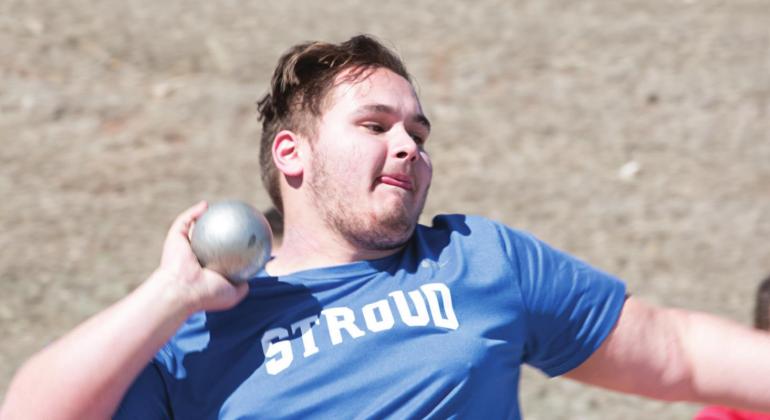 Pictured above, Wiley Gunter looks towards the field while he throws the shot put. Photo/Brian Blansett
